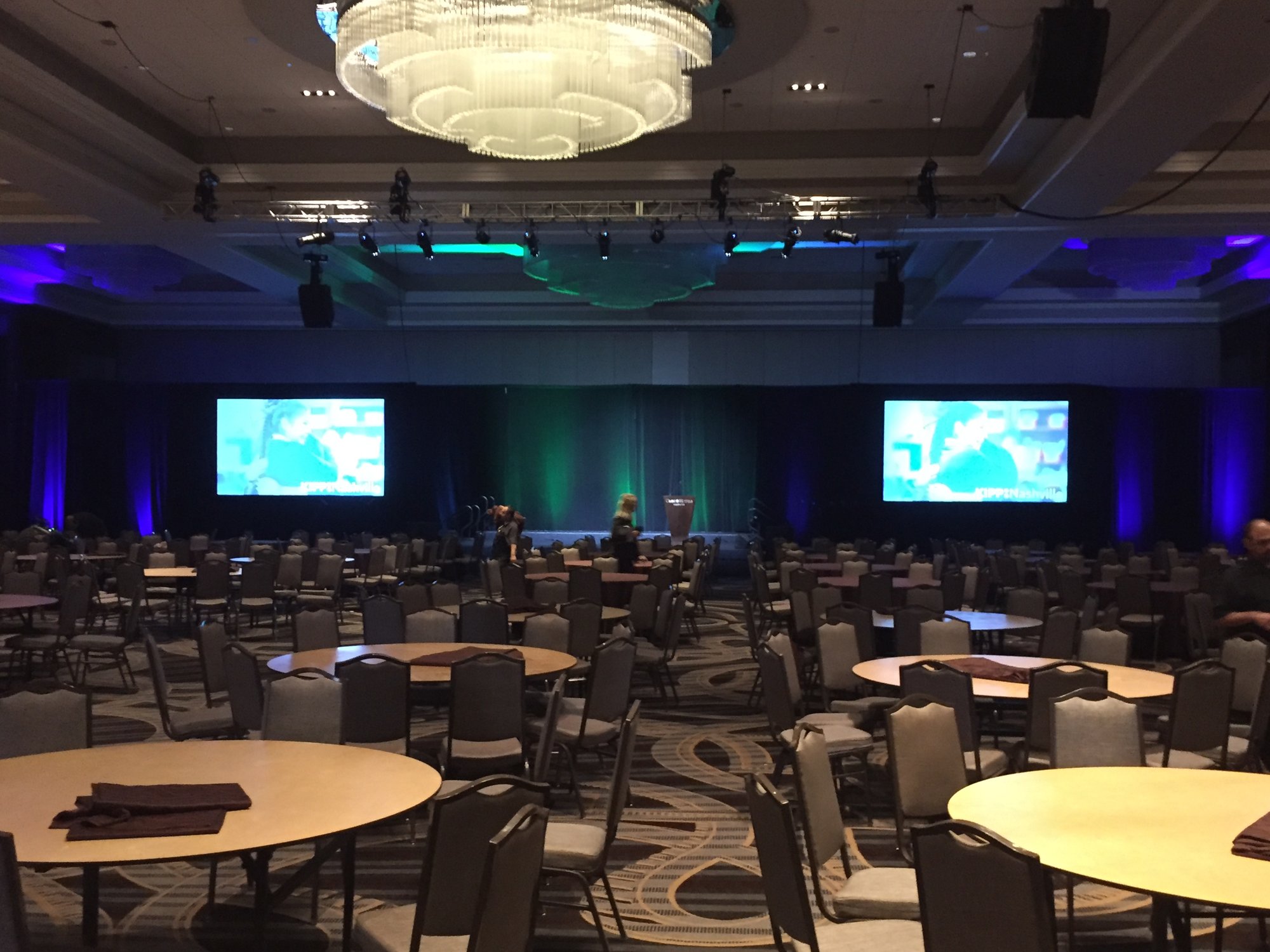 Corporate General Session  Audio visual production for a corporate conference with dual projection screens, professional sound system, and stage lighting.